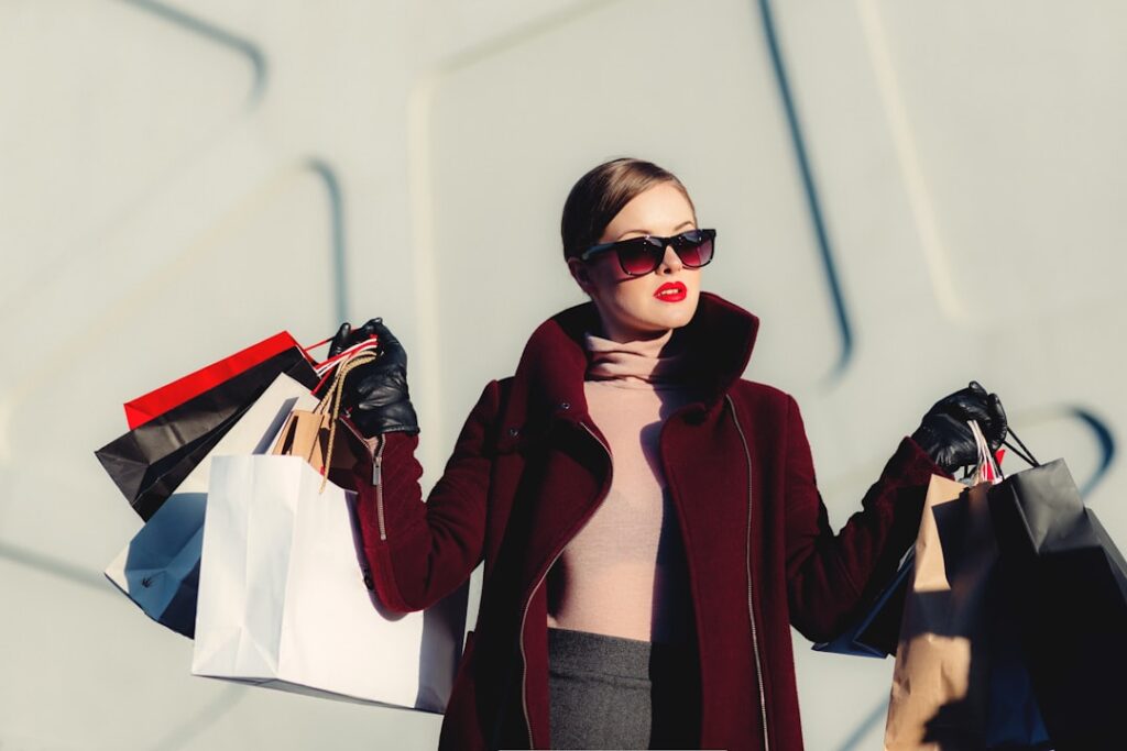 woman holding shopping bags: How Companies are Rethinking Production to Conserve Resources
